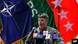 U.S. Army Gen. Scott Miller, the top U.S. commander in Afghanistan, speaks at a ceremony where he relinquished his command, at Resolute Support headquarters, in Kabul, Afghanistan, July 12, 2021. 