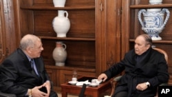 A photo released by the Algerian Press Service) on June 13, 2013 shows Algeria's President Abdelaziz Bouteflika (R) receiving Algerian Chief of Staff Ahmed Gaid Salah in a military hospital, in Paris, France. 