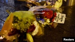 Flowers are laid at the scene after an attack on Westminster Bridge in London, March 22, 2017. 