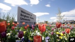 FILE - This April 19, 2016, file photo, shows a welcome sign to Brigham Young University in Provo, Utah.