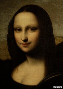 The portrait of Mona Lisa is pictured on a painting attributed to Leonardo da Vinci during a presentation in Geneva September 27, 2012.