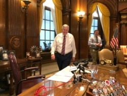 FILE - Missouri Gov. Mike Parson arrives for a news conference in his Capitol office in Jefferson City, May 14, 2019.
