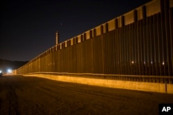 A portion of the new steel border fence stretches along the US-Mexico border in Sunland Park, New Mexico, March 30, 2017.