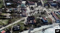 FILE - An aerial shot shows widespread destruction caused by Cyclone Kenneth when it struck Ibo island north of Pemba city in Mozambique, May, 1, 2019.