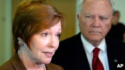 FILE - In this Thursday, Oct. 16, 2014 file photo, Brenda Fitzgerald, Georgia Department of Public Health commissioner, left, and Gov. Nathan Deal respond to questions about Ebola victims at Emory University Hospital.