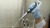 A scientist prepares a blood sample in a laboratory at the Center for Scientific Research Caucaseco in the outskirts of Cali, Colombia, April 25, 2012.