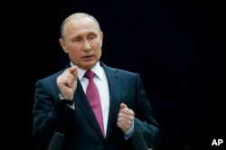 Russian President Vladimir Putin gestures while speaking to the media after his annual televised call-in show in Moscow, Russia, June 15, 2017. The 64-year old Russian leader mixed tough talk with benevolent promises while addressing disgruntled callers.