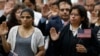 FILE - Immigrants take the citizenship oath during naturalization ceremonies at a U.S. Citizenship and Immigration Services (USCIS) ceremony in Los Angeles, California, Sept. 20, 2017.