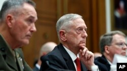 Joint Chiefs Chairman Gen. Joseph Dunford, left, Defense Secretary Jim Mattis, and Defense Under Secretary and Chief Financial Office David Norquist, listen to a question as they testify at a House Armed Services Committee hearing on the FY'18 defense bud