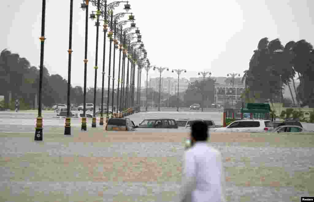 Cars are stuck in a flooded street in the southern city of Salalah, Oman, after Cyclone Merkunu, May 26, 2018. (Credit: Oman News Agency)