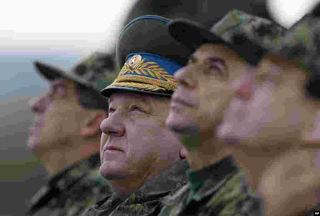 Russian General Vladimir Shamatov, second from left, observes Russian-Serbian joint anti-terrorist exercise Srem 2014, at Nikinci training ground, 60 kilometers west of Belgrade, Serbia.