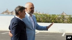 Albanian Prime Minister Edi Rama , right, welcomes Bosnia and Hercegovina's counterpart Denis Zvizdic during an an informal meeting of Western Balkans countries in the Albanian port city of Durres, 33 kilometers (20 miles) west of the Tirana.