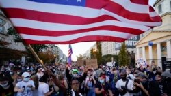 Description: FILE - Nov. 7, 2020, Watu walikusanyika katika mtaa wa Black Lives Matter Plaza kusheherekea ushindi wa Rais mteule Joe Biden kuwa rais wa 46th wa Marekani. (AP Photo/Alex Brandon, File)