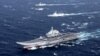 FILE - China's Liaoning aircraft carrier with accompanying fleet conducts a drill in an area of South China Sea, in this December 2016 photo.