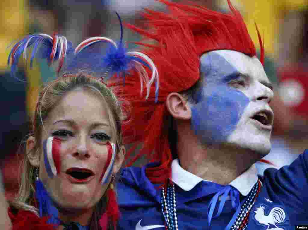 French fans in full regalia before the game against Nigeria, at the national stadium in Brasilia, June 30, 2014.