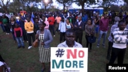 FILE - People sing as they attend a memorial concert at the "Freedom Corner" in Kenya's capital Nairobi, April 14, 2015, in memory of the Garissa university students who were killed by gunmen.