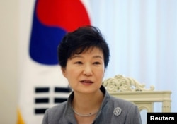 FILE - South Korean President Park Geun-hye speaks during an interview at the Presidential Blue House in Seoul Sept. 16, 2014.