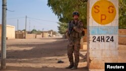 A French soldier secures an area next to an abandoned jihadist bomb factory in Gao, Mali, February 13, 2013. 