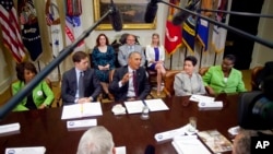 President Barack Obama talks during his meeting with small-business owners and members of Congress to discuss the importance of the reauthorization of the Export-Import Bank in the Roosevelt Room of the White House in Washington, July 22, 2015.