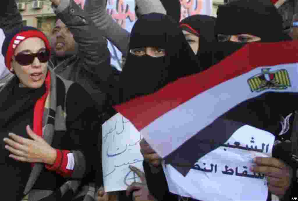 Women demonstrate in Tahrir Square, the central Cairo plaza that has become the protests' epicenter, in Cairo, Egypt, Monday Jan. 31, 2011. A coalition of opposition groups called for a million people to take to Cairo's streets Tuesday to ratchet up press