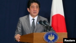Japan's Prime Minister Shinzo Abe during a news conference in Doha, August 28, 2013 file photo. 
