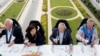 Guests enjoy a Dinner in the Sky meal on a platform suspended from a crane at a height of 40 metres (131 ft.) in front of the Arcades du Cinquantenaire in Brussels, June 8, 2017. 