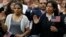 FILE - Immigrants take the citizenship oath during naturalization ceremonies at a U.S. Citizenship and Immigration Services ceremony in Los Angeles, California, Sept. 20, 2017.