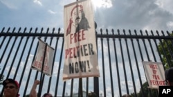 FILE - Tribal leaders and supporters urge then-President Joe Biden to grant clemency to imprisoned Native American activist Leonard Peltier on his 79th birthday, in Washington, Sept. 12, 2023.