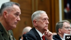 Joint Chiefs Chairman Gen. Joseph Dunford, left, Defense Secretary Jim Mattis, and Defense Under Secretary and Chief Financial Office David Norquist, listen to a question as they testify at a House Armed Services Committee hearing on the FY'18 defense bud