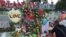 People leave flowers and other items at a makeshift vigil outside the Orlando Regional Medical Center, which is close to where the mass shooting occurred at the Pulse gay nightclub early Sunday in Orlando, Florida, June 14, 2016.