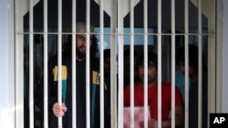 In this Dec. 14, 2019, photo, jailed Taliban are seen inside the Pul-e-Charkhi jail in Kabul, Afghanistan. 