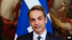 Greek Premier Kyriakos Mitsotakis attends a joint press conference with Italian Premier Giuseppe Conte, at Chigi Palace government's office, in Rome, Nov. 26, 2019. 