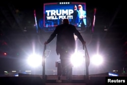 FILE - Republican presidential nominee and former U.S. President Donald Trump gets on stage to deliver remarks during a rally at Lee's Family Forum in Henderson, Nevada, Oct. 31, 2024.