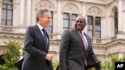 U.S. Secretary of State Antony Blinken, left, talks to Britain's Foreign Secretary David Lammy as he arrives for a meeting at the Foreign, Commonwealth and Development Office (FCDO) in London, Sept. 10, 2024.