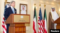 US Secretary of State John Kerry (L) and Kuwait's Deputy Prime Minister and Minister of Foreign Affairs Sheikh Sabah Khalid Hamad al-Sabah speak to the media in Kuwait City June 26, 2013.