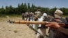 Pasukan Taliban berlatih menembak di lokasi yang disembunyikan di Afghanistan, pada 14 Juli 2009. (Foto: Reuters/Stringer)