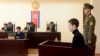 U.S. citizen Matthew Todd Miller (2nd R) sits in a witness box during his trial at the North Korean Supreme Court in Pyongyang, September 14, 2014.