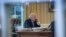 FILE - President Donald Trump speaks on the phone in the Oval Office at the White House in Washington, Jan. 28, 2017.