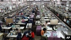 Laborers work at a garment factory in Burma. (file) The U.S. has allowed the general import ban on Burmese products to lapse. 