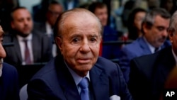 FILE - Former Argentine President Carlos Menem sits in a courthouse in Buenos Aires, Feb. 28, 2019.