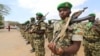 FILE - African Union Mission in Somalia (AMISOM) peacekeepers from Burundi stand in formation during a ceremony as they prepare to leave the Jaale Siad military academy after being replaced by the Somali military in Mogadishu, Somalia, Feb. 28, 2019. 