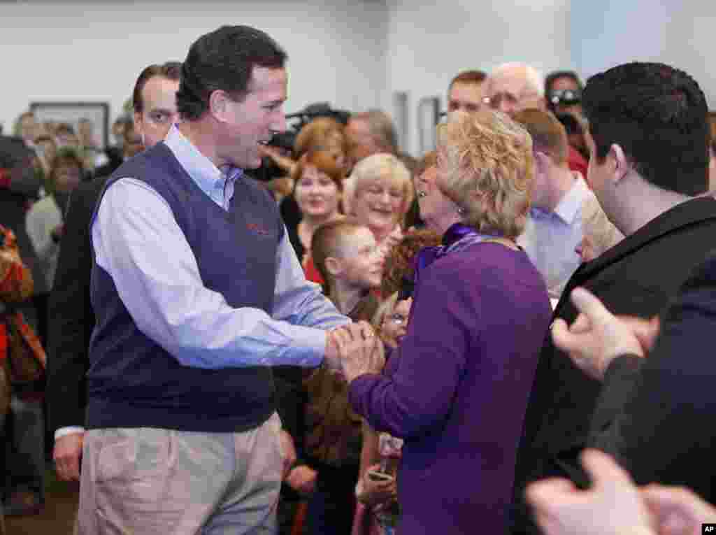 Republican presidential candidate Rick Santorum moved on to campaign in Colorado. Here he greets supporters at the Lone Tree Golf Club in Lone Tree, Colorado on January 31, 2012. (AP)
