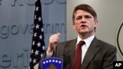 FILE - U.S. Deputy Assistant Secretary Tom Countryman gestures during a news conference in Kosovo, capital Pristina, Feb. 12, 2011. 