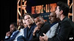 FILE - Actors Malcolm-Jamal Warner, from left, Sterling K. Brown, Sarah Paulson, John Travolta, Cuba Gooding Jr., Courtney B. Vance and David Schwinner participate in "The People v. O.J. Simpson" panel, Jan. 16, 2016.