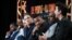 FILE - Actors Malcolm-Jamal Warner, from left, Sterling K. Brown, Sarah Paulson, John Travolta, Cuba Gooding Jr., Courtney B. Vance and David Schwinner participate in "The People v. O.J. Simpson" panel, Jan. 16, 2016.