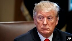 President Donald Trump listens during a cabinet meeting at the White House, Jan. 2, 2019, in Washington.