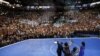 U.S. President Barack Obama (L) waves at supporters as he leads his family across the stage at the Democratic National Convention in Charlotte, North Carolina September 6, 2012. 