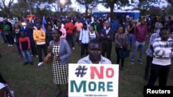 People sing as they attend a memorial concert at the "Freedom Corner" in Kenya's capital Nairobi, April 14, 2015, in memory of the Garissa university students who were killed by gunmen.