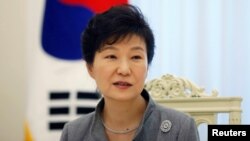 FILE - South Korean President Park Geun-hye speaks during an interview at the Presidential Blue House in Seoul Sept. 16, 2014.