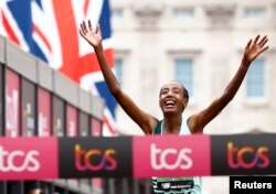 Netherlands' Sifan Hassan reacts as she crosses the finish line to win the elite women's race in the London marathon, London, April 23, 2023.